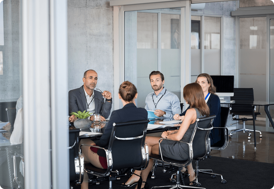 Business meeting in modern conference room.